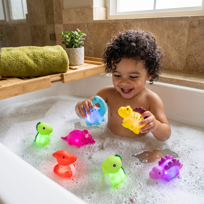 Juguete de dinosaurios luminosos para el baño